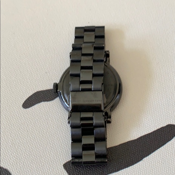 Matte black and gold Marc by Marc Jacobs watch.
